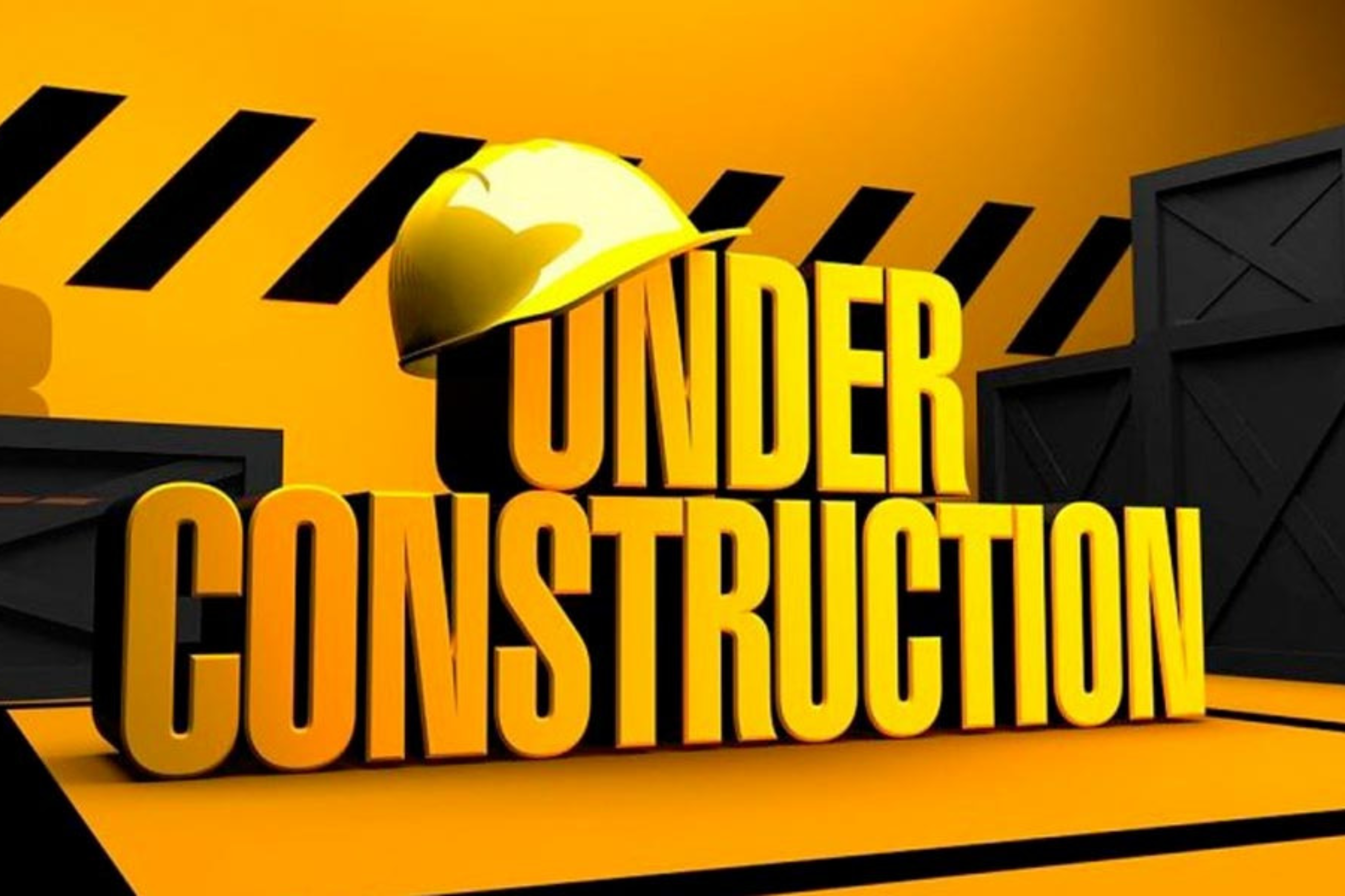 Imagen de las palabras "UNDER CONSTRUCTION" con un casco de seguridad sobre ellas.
